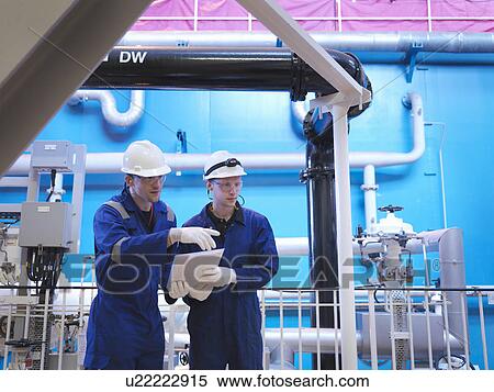 Stock Photography - Engineer in Turbine Hall. Fotosearch