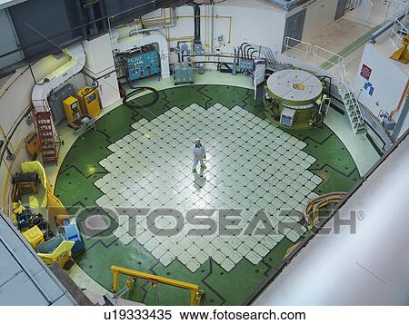 Stock Photography - Engineer on Nuclear Reactor Pile cap. Fotosearch