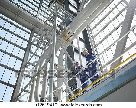 Engineers in Charging Hall View Large Photo Image Stock Image - Engineers in Charging Hall. Fotosearch