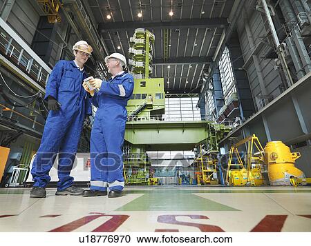 Engineers in Charging Hall View Large Photo Image Stock Image - Engineers in Charging Hall. Fotosearch