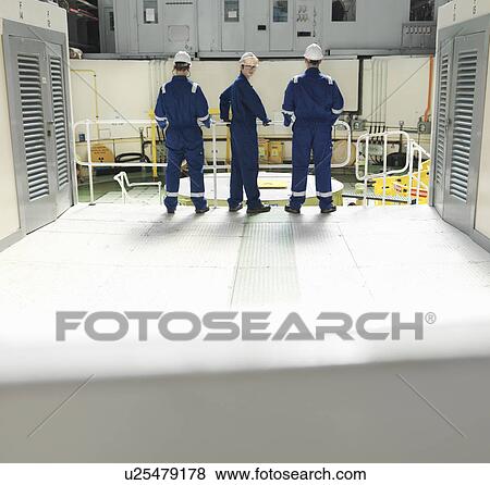 Engineers in Charging Hall View Large Photo Image Stock Photo - Engineers in Charging Hall. Fotosearch