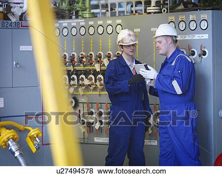Stock Photo - Engineers in Charging Hall. Fotosearch