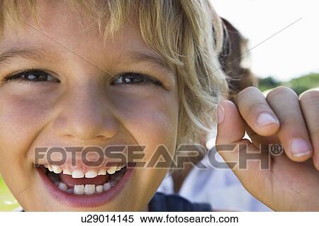 Extreme close-up of a young boy smiling View Large Photo Image Stock Photography - Extreme close-up of a young boy smiling. Fotosearch