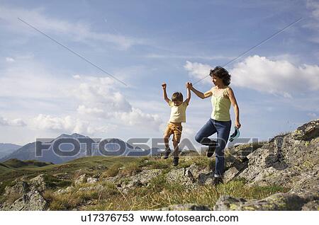 Stock Image - Family excursion to mountains. Fotosearch