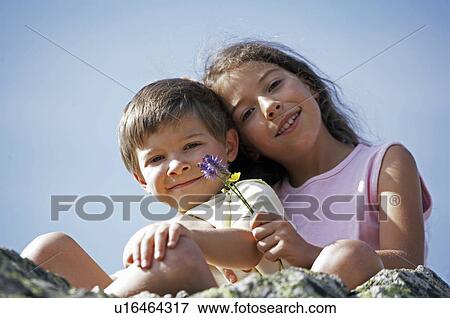 Stock Photo - Family excursion to mountains. Fotosearch