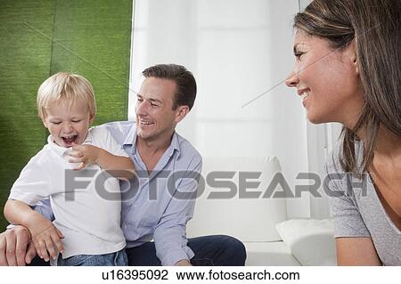 Family having fun at home View Large Photo Image Stock Image - Family having fun at home. Fotosearch