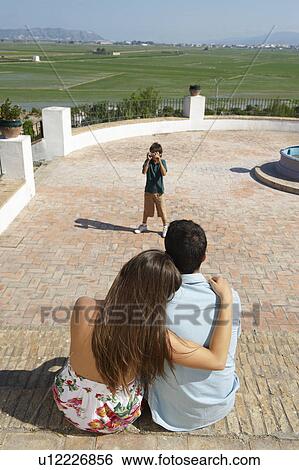 Family on holiday posing for snapshot View Large Photo Image Stock Photograph - Family on holiday posing for snapshot. Fotosearch