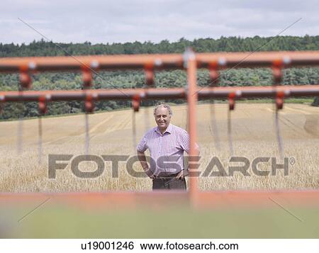 Farmer checking crop View Large Photo Image Stock Photograph - Farmer checking crop. Fotosearch