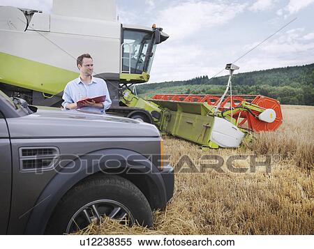 Farmer checking crop View Large Photo Image Stock Photography - Farmer checking crop. Fotosearch