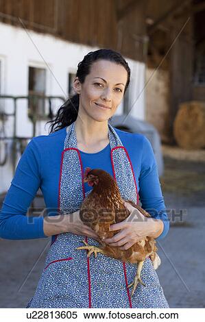 Farmwoman with hen View Large Photo Image Stock Photography - Farmwoman with hen. Fotosearch
