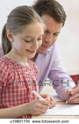 Father and daughter doing homework View Large Photo Image Picture - Father and daughter doing homework. Fotosearch