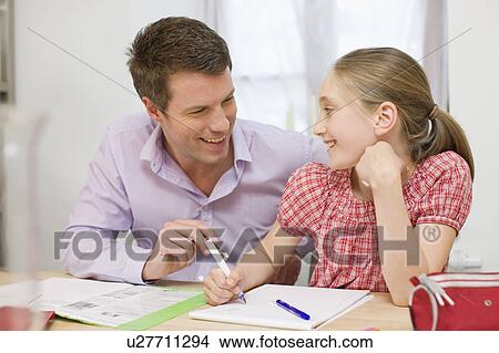 Father and daughter doing homework View Large Photo Image Picture - Father and daughter doing homework. Fotosearch