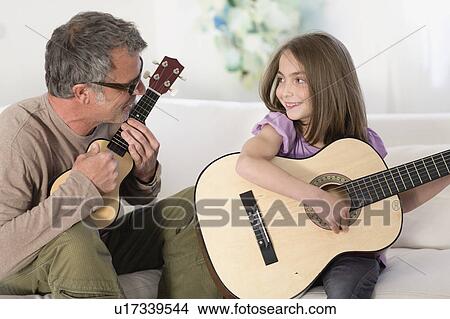 Father and daughter making music View Large Photo Image Picture - Father and daughter making music. Fotosearch