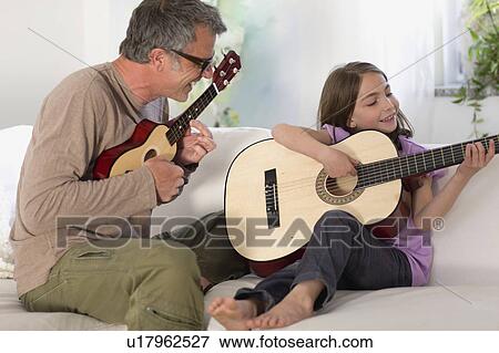 Father and daughter making music View Large Photo Image Stock Photo - Father and daughter making music. Fotosearch
