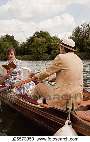 Father and daughter on a vintage boat View Large Photo Image Stock Image - Father and daughter on a vintage boat. Fotosearch