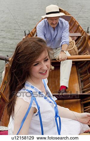 Father and daughter on a vintage boat View Large Photo Image Stock Photo - Father and daughter on a vintage boat. Fotosearch