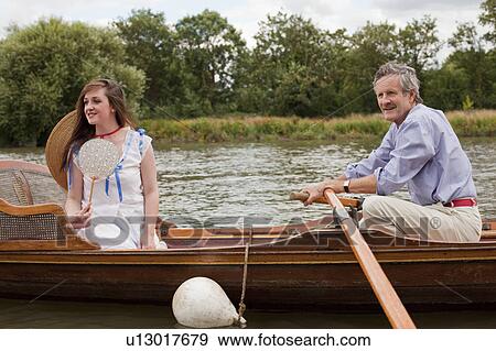 Father and daughter on a vintage boat View Large Photo Image Stock Photo - Father and daughter on a vintage boat. Fotosearch
