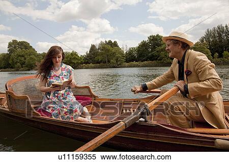 Father and daughter on a vintage boat View Large Photo Image Stock Photography - Father and daughter on a vintage boat. Fotosearch
