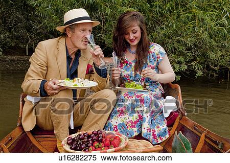 Father and daughter on a vintage boat View Large Photo Image Stock Photography - Father and daughter on a vintage boat. Fotosearch