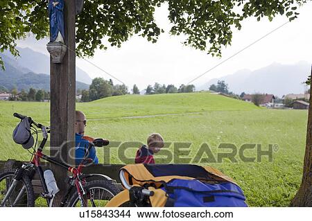 Picture - Father and son having a break. Fotosearch