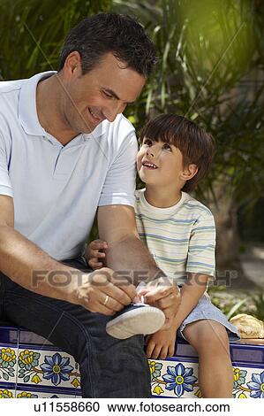 Father helping his son View Large Photo Image Stock Image - Father helping his son. Fotosearch