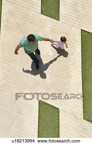 Father walking with infant daughter View Large Photo Image Picture - Father walking with infant daughter. Fotosearch