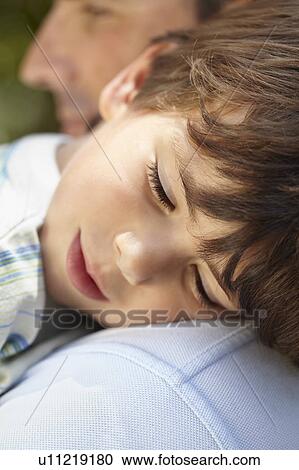 Father with sleeping son View Large Photo Image Stock Image - Father with sleeping son. Fotosearch