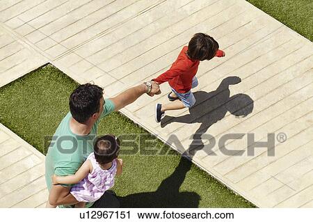 Father with two children View Large Photo Image Stock Image - Father with two children. Fotosearch