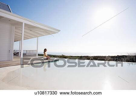 Female doing yoga outside her house View Large Photo Image Stock Image - Female doing yoga outside her house. Fotosearch