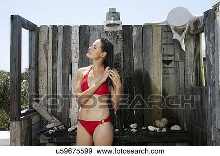 Stock Photo - Female in open shower. Fotosearch