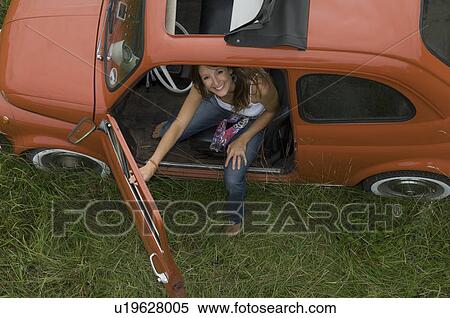 Female looking out of car View Large Photo Image Stock Photography - Female looking out of car. Fotosearch