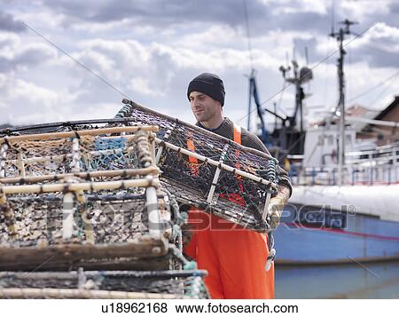 Fisherman loading lobster pots View Large Photo Image Stock Photo - Fisherman loading lobster pots. Fotosearch