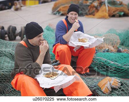 Fishermen eating fish and chips View Large Photo Image Stock Photography - Fishermen eating fish and chips. Fotosearch