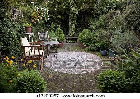 Flowers in vases and an English Garden View Large Photo Image Stock Photo - Flowers in vases and an English Garden. Fotosearch
