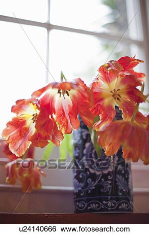 Stock Photograph - Flowers in vases and an English Garden. Fotosearch