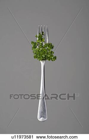 Stock Image - Fork with parsley. Fotosearch