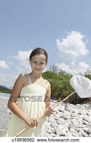 Stock Image - Free Time by the River in the Mountains. Fotosearch