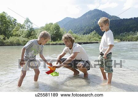 Stock Photo - Free Time by the River in the Mountains. Fotosearch