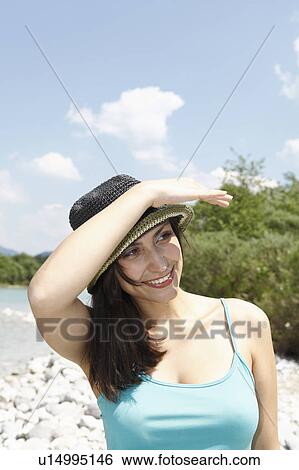 Stock Photograph - Free Time by the River in the Mountains. Fotosearch