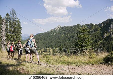 Stock Photo - Friends contemplating the scenery. Fotosearch