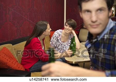 Friends in a bar / restaurant View Large Photo Image Stock Image - Friends in a bar / restaurant. Fotosearch