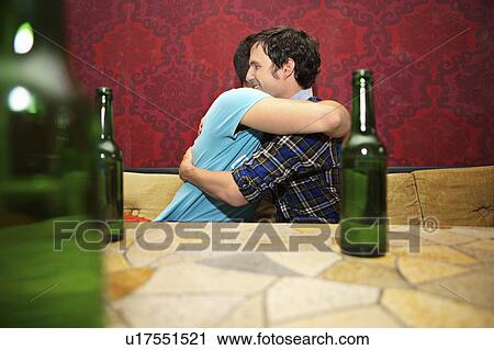 Stock Image - Friends in a bar / restaurant. Fotosearch