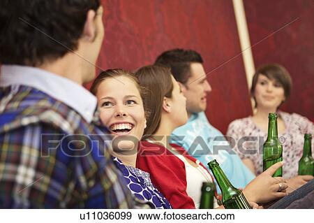 Friends in a bar / restaurant View Large Photo Image Stock Photo - Friends in a bar / restaurant. Fotosearch
