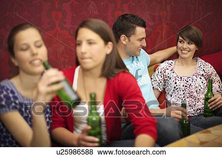 Stock Photo - Friends in a bar / restaurant. Fotosearch