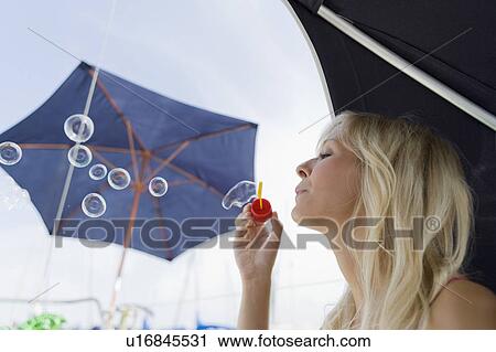 Girl blowing bubbles View Large Photo Image Stock Image - Girl blowing bubbles. Fotosearch