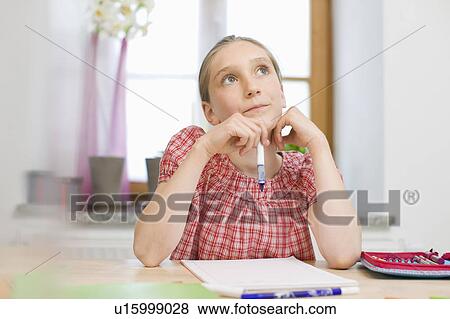 Girl doing homework View Large Photo Image Stock Photo - Girl doing homework. Fotosearch