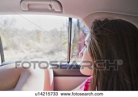 Stock Image - Girl in car. Fotosearch
