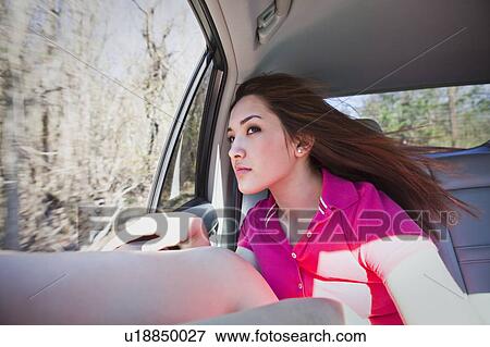 Girl in car View Large Photo Image Stock Photo - Girl in car. Fotosearch