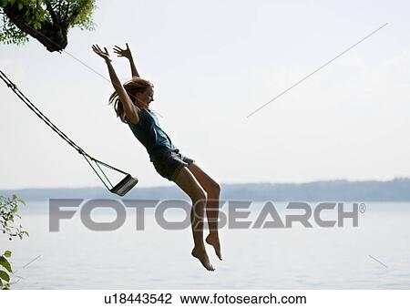 Girl jumping from swing View Large Photo Image Stock Image - Girl jumping from swing. Fotosearch