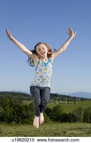 Girl jumping View Large Photo Image Stock Photography - Girl jumping. Fotosearch